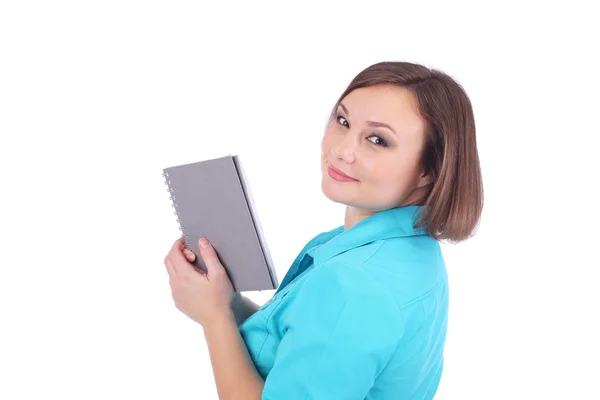 Pretty young woman with writing book — Stock Photo, Image