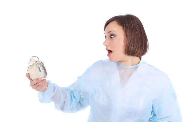 Femme en uniforme médical avec horloge — Photo