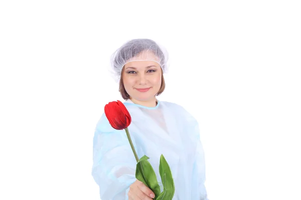 Fiatal orvos piros virággal — Stock Fotó