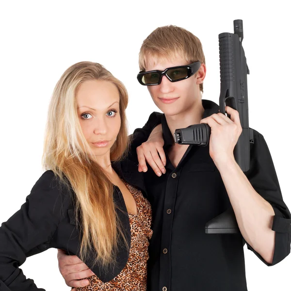 Menina e cara com arma — Fotografia de Stock