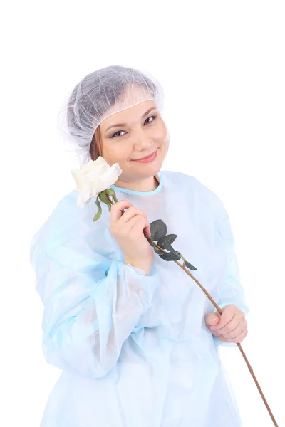 Pretty young doctor with flower — Stock Photo, Image