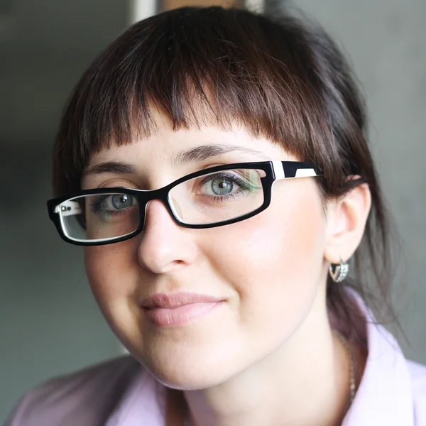 Brunette student girl in glasses — Stock Photo, Image