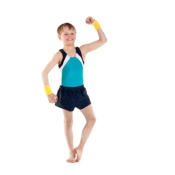Gymnastka chlapce ukazuje svaly — Stock fotografie