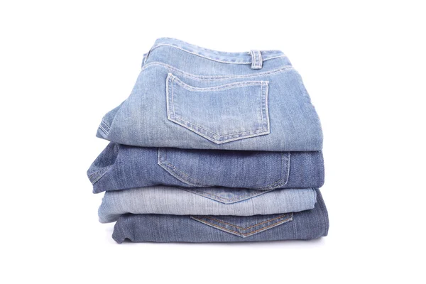 Flera jeans isolerade — Stockfoto