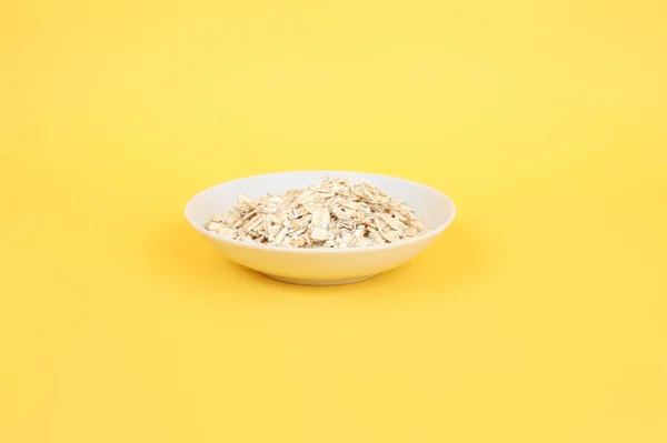 White plate of oats — Stock Photo, Image