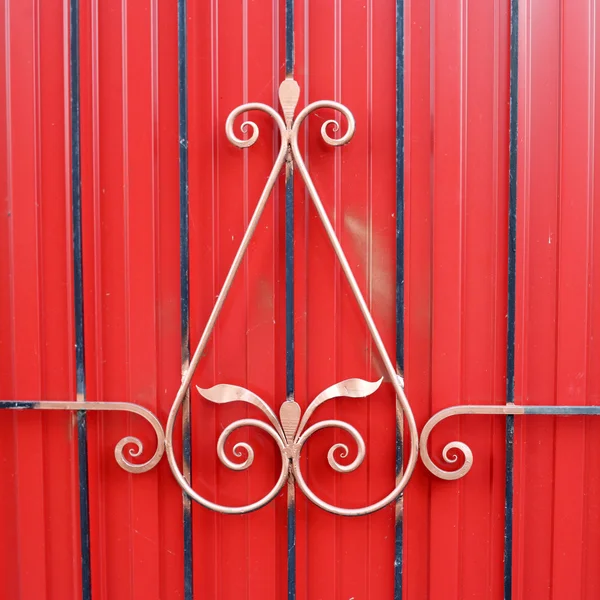 Golden decoration on the fence — Stock Photo, Image