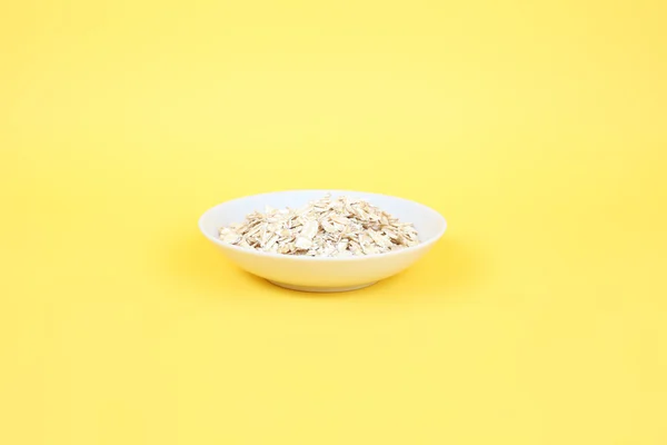 White plate of oats — Stock Photo, Image