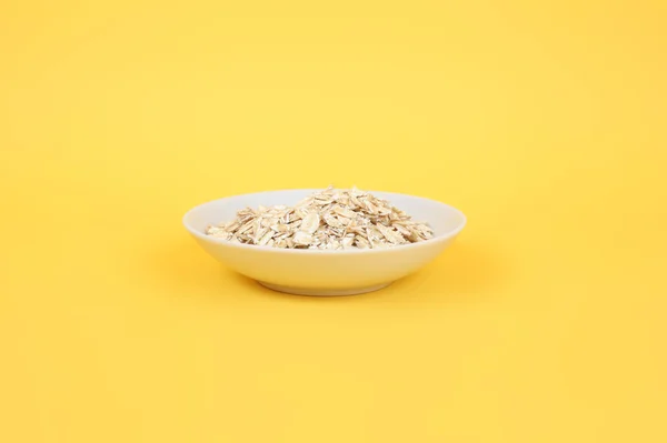 Oats on the yellow — Stock Photo, Image