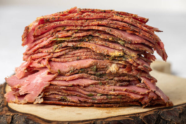 stack of sliced pastrami meat