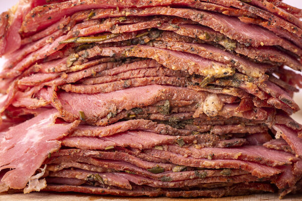 stack of sliced pastrami meat