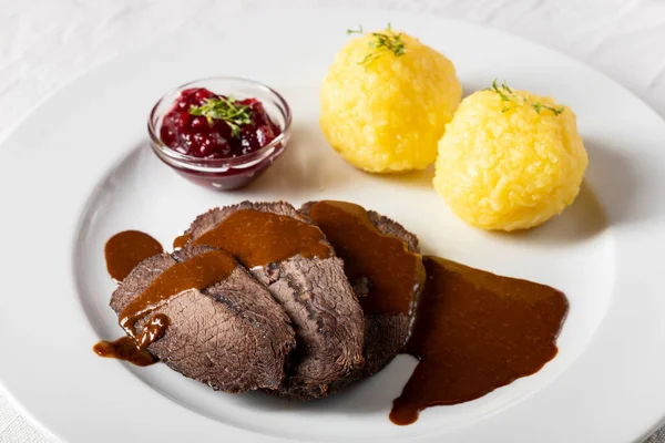 German Sauerbraten Recipe 1 depositphotos 488586468 stock photo closeup german sauerbraten dumplings
