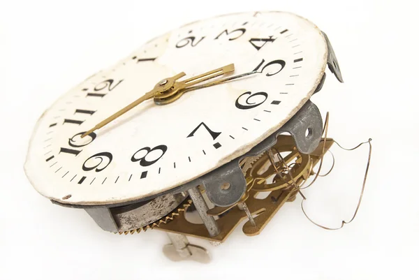 Old alarm clock with mechanical exploded charging on a white bac — Stock Photo, Image