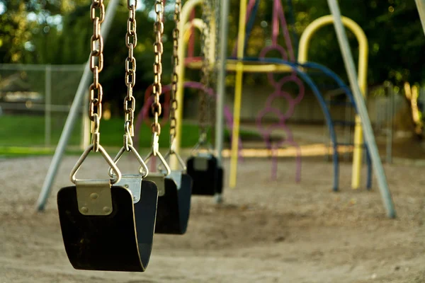 Swing Set Playground Empty Lighting Warm Due Being Taken Sunset — Stock Photo, Image