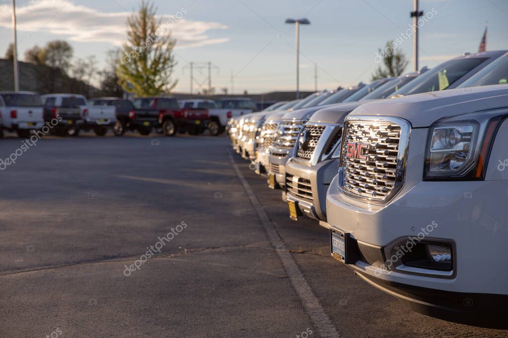 NAMPA, IDAHO - APRIL 28, 2020: Row of GMC vehicles ready and waiting for sale at a Nampa Chevrolet dealership