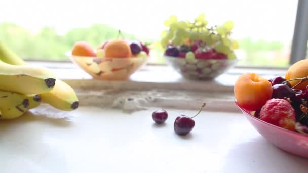 Different Summer fruits on a window sill — Stock Video