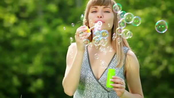 Girl blowing  bubbles — Stock Video