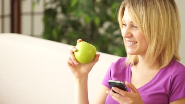 Lovely girl holding phone — Stock Video