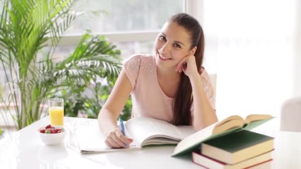 Girl sitting at table — Stock Video