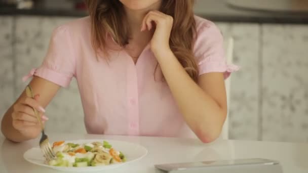 Cute girl  eating salad — Wideo stockowe