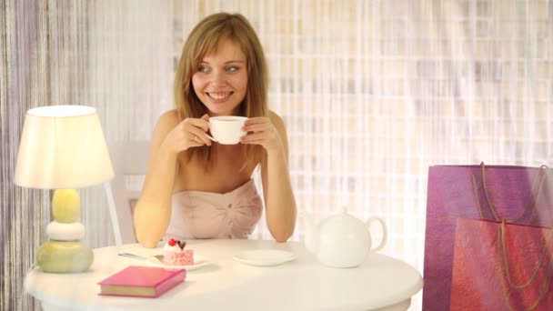 Charming girl sitting at cafe — Stock Video