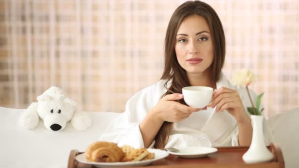 Young woman  drinking tea — Stock Video