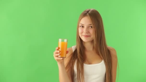 Cheerful girl  drinking juice — Stock Video