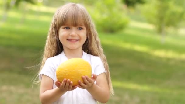 Child holding  a melon — Stock Video