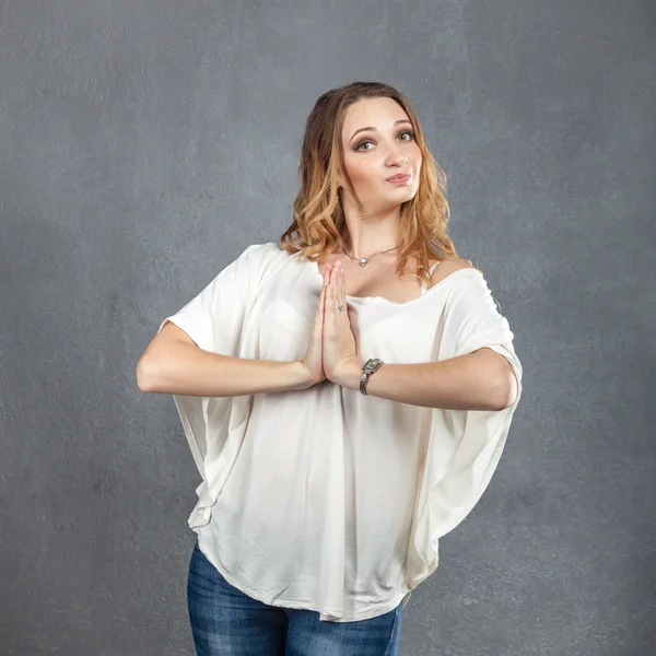 Pretty model with praying hands — Stock Photo, Image