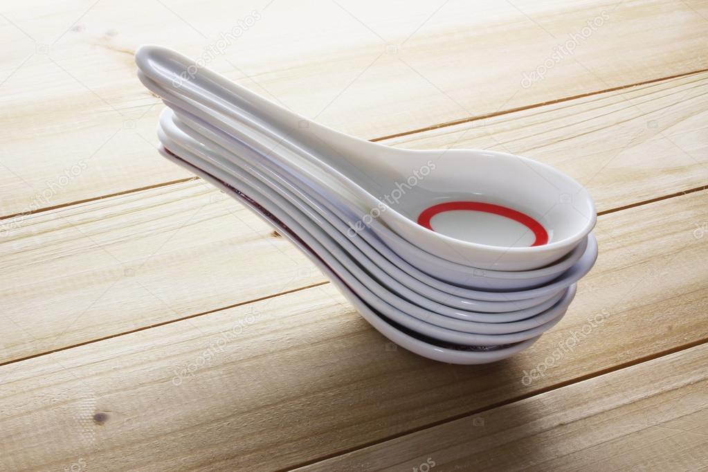 Stack of Chinese Soup Spoons — Stock Photo © newlight 115970754