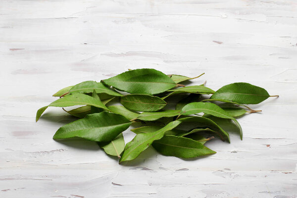 Lemon Myrtle Leaves on Wooden Background