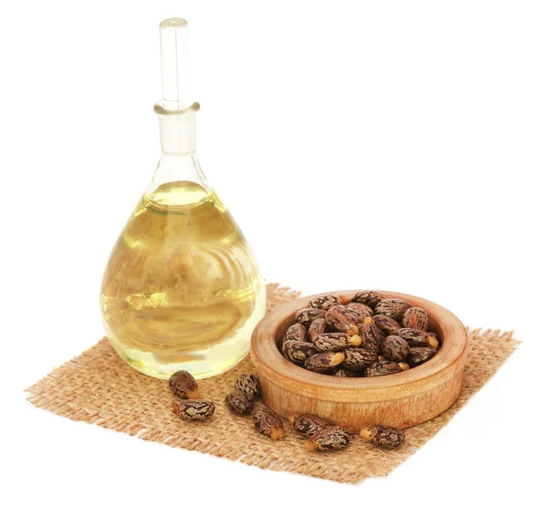 Castor oil with beans — Stock Photo, Image