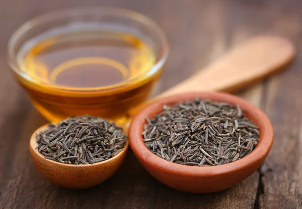 Caraway seeds with essential oil — Stock Photo, Image