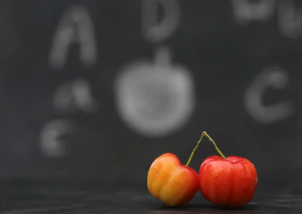 Back to school concept with ripe cherry — Stock Photo, Image