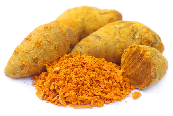 Whole and grated turmeric — Stock Photo, Image