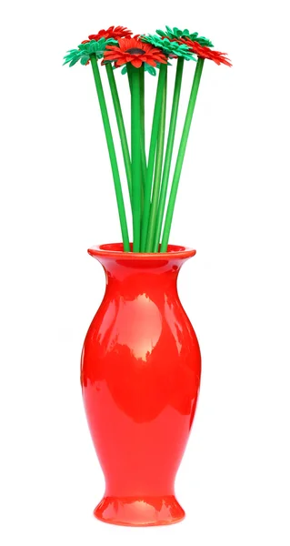 Red flower vase with plastic flower — Stock Photo, Image