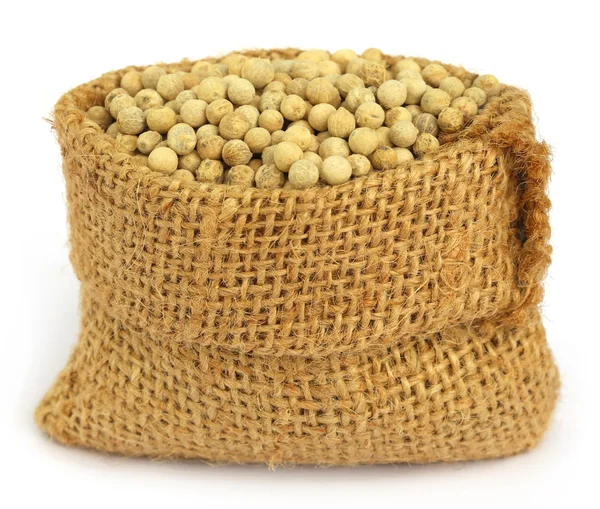 White peppercorns in sack — Stock Photo, Image