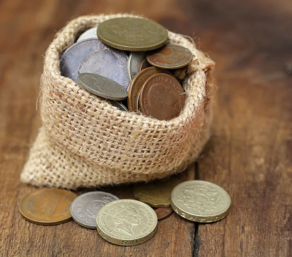 Old coins in sack bag — Stock Photo, Image