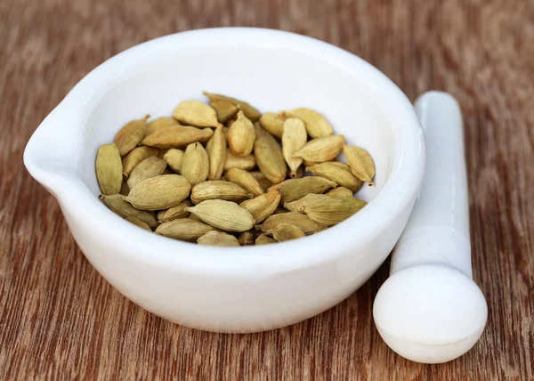 Cardamom seeds in a mortar — Stock Photo, Image