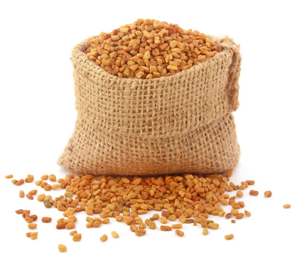 Fenugreek seeds in sack — Stock Photo, Image