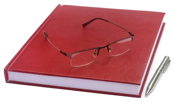 Kastanjebruine gekleurde proefschrift papier met bril — Stockfoto