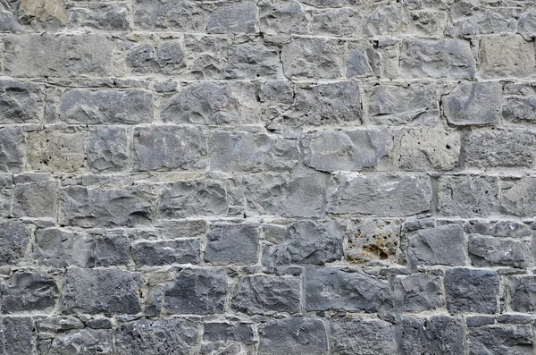 Alte Steinmauer mit Zement, Textur Hintergrund lizenzfreie Stockfotos