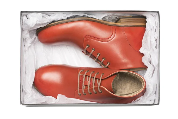 Nové červené boty v poli — Stock fotografie