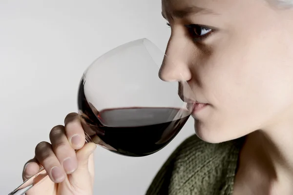 Woman drinking red wine — Stock Photo, Image