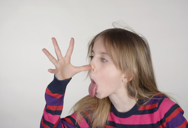 girl puts out her tongue