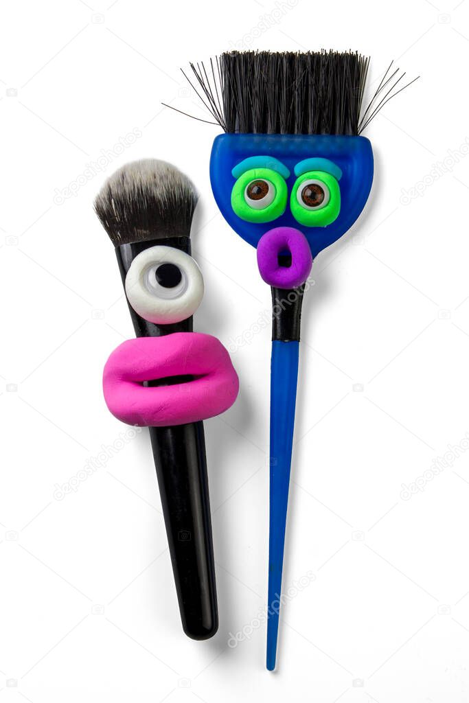 Animated makeup brushes with eyes and pink lips by soft clay.