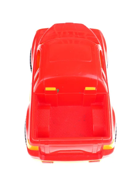 Carro de brinquedo vermelho em um fundo branco — Fotografia de Stock