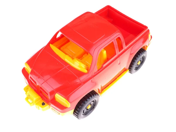 Carro de brinquedo vermelho em um fundo branco — Fotografia de Stock