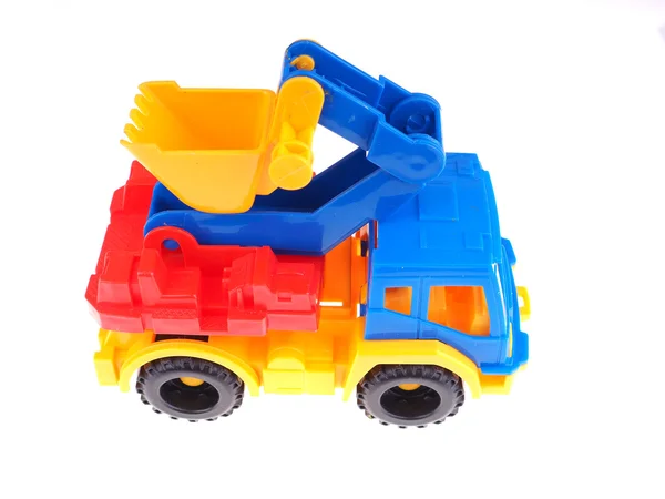 Caminhão de brinquedo com um balde em um fundo branco — Fotografia de Stock