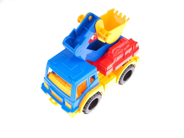 Caminhão de brinquedo com um balde em um fundo branco — Fotografia de Stock