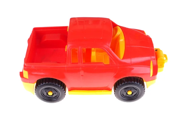 Coche de juguete rojo sobre un fondo blanco —  Fotos de Stock